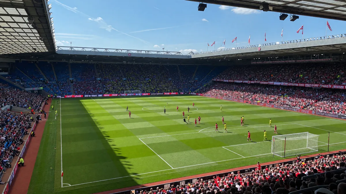 Football stadium pitch during a daytime league match