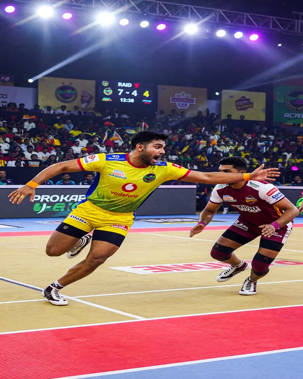 Kabaddi raider in full sprint across the mat under bright arena lights